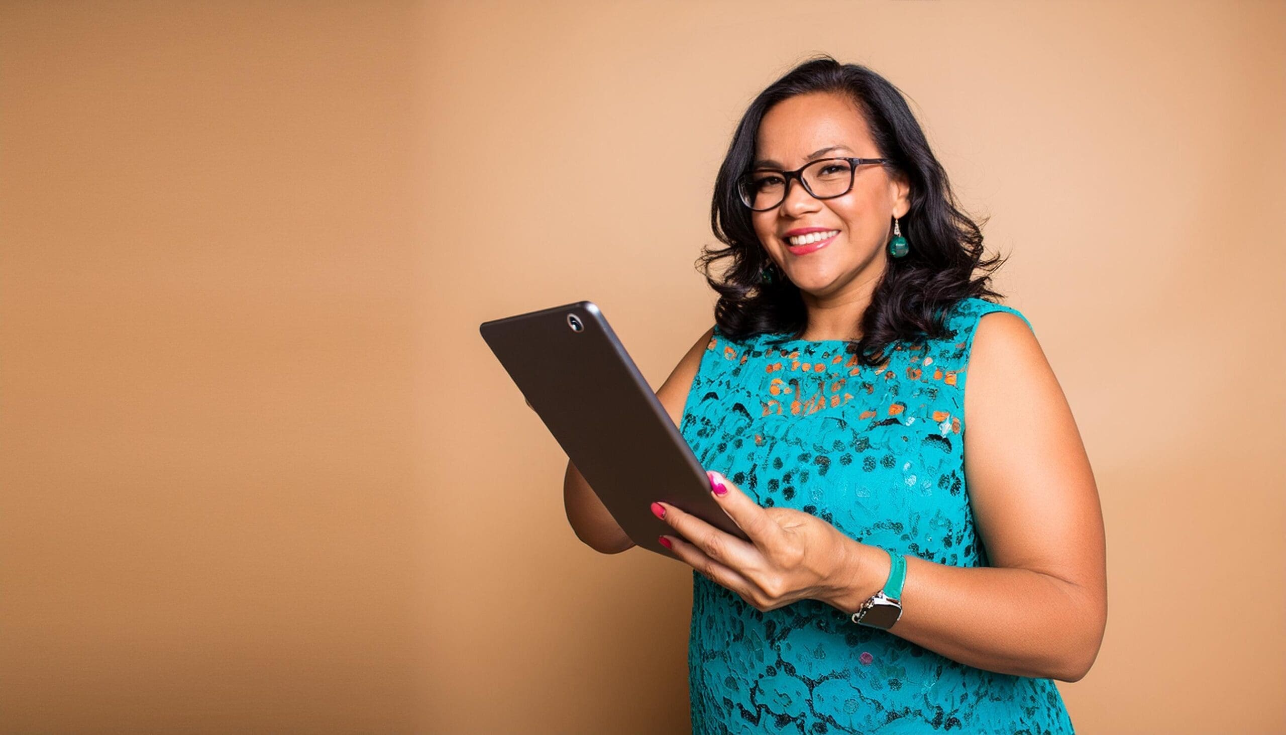 A woman in teal demonstrating how to calculate event ROI using event management software against an orange background.