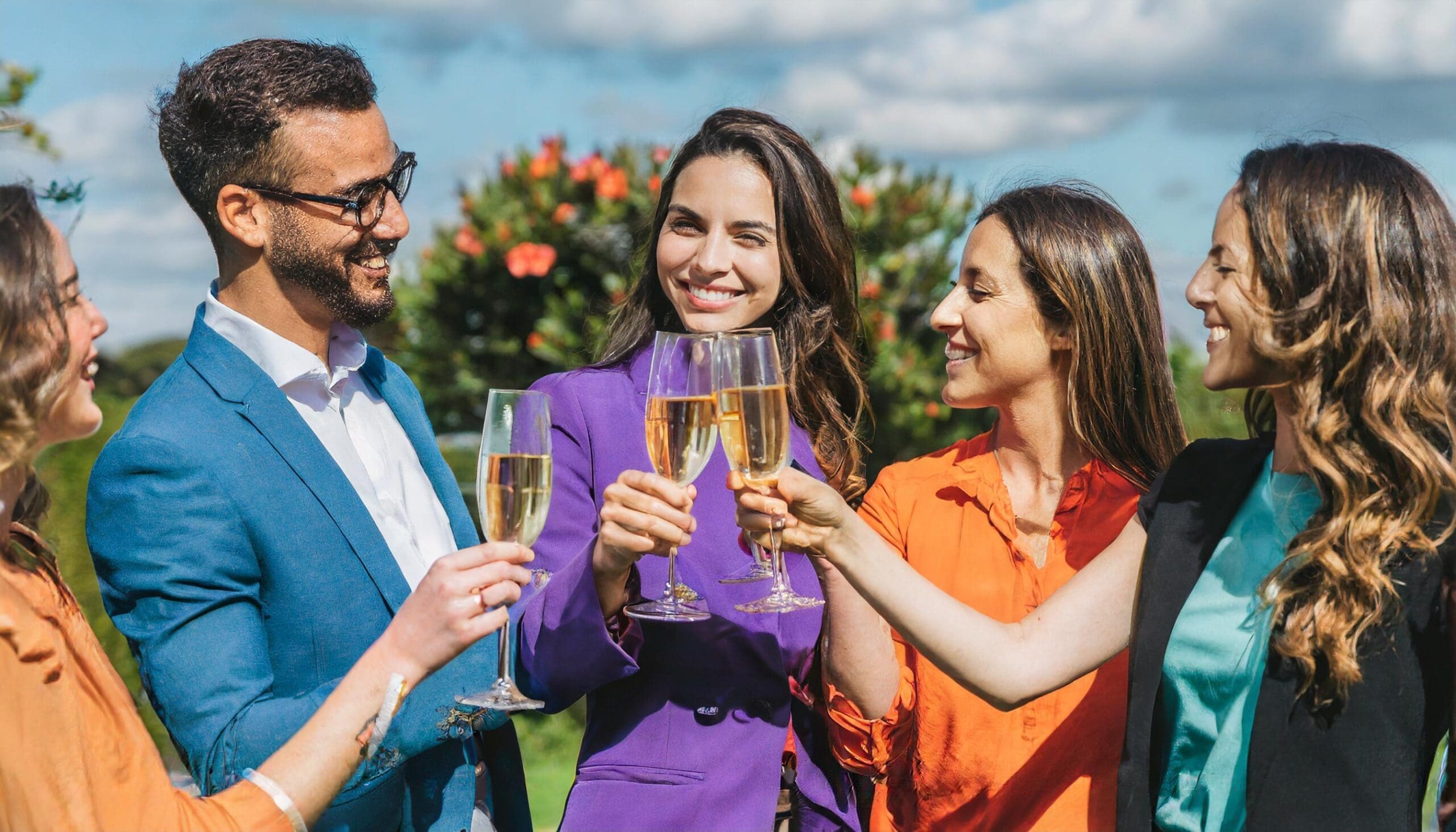 People celebrating with champagne because they knew how to save money on events