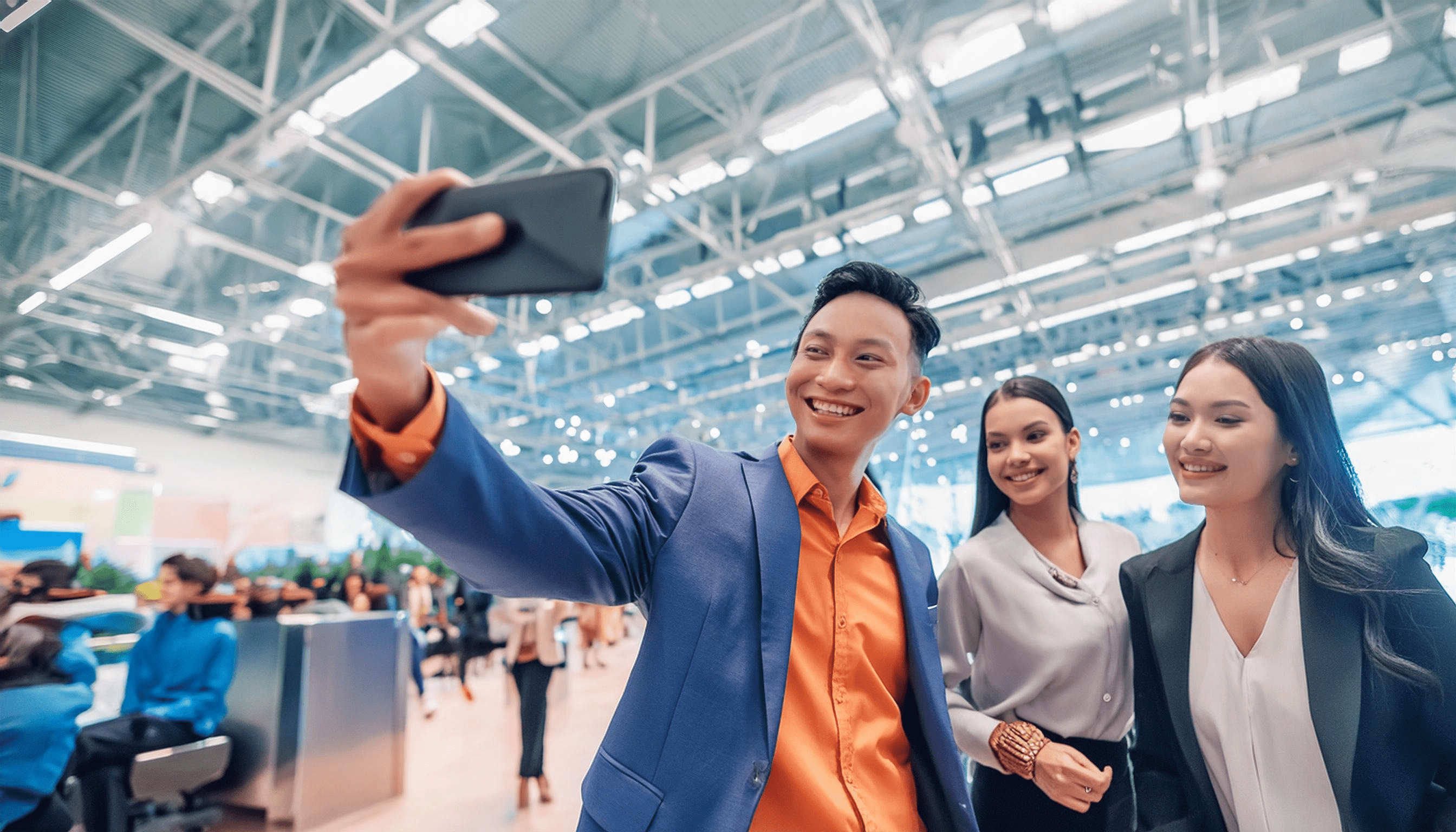 A picture of event attendees taking a group selfie. This image is meant to conceptualize the idea of user-generated content for events.